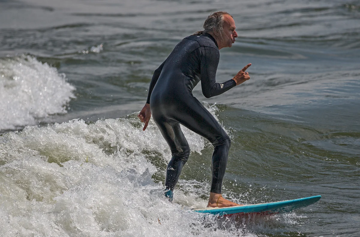 MONTREAL, QC. AUGUST 16 2013 -- A man rides the running wave in Lasalle, just off the island of Montreal in the St. Lawrence river on Friday, August 16, 2013. (Leslie Schachter/unpublished)