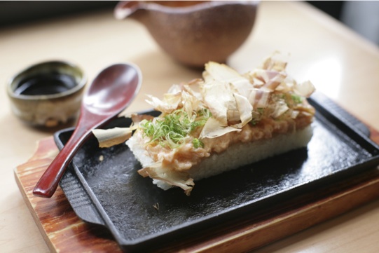 Szechuan Spiced Salmon with Bonito Flakes over Crispy Rice at Neta