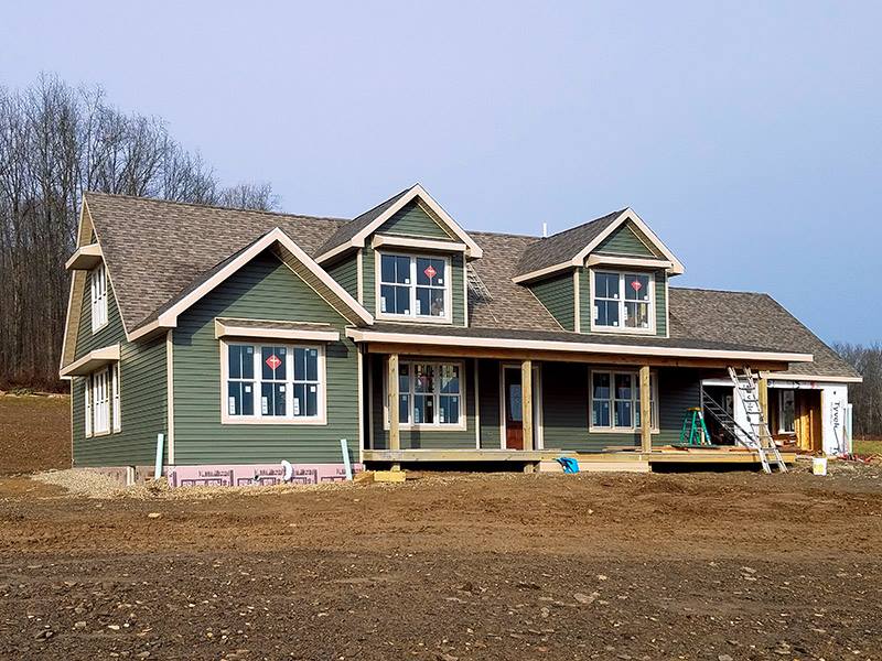 Construction Progress: Exterior Siding, Roofing and Windows Installed.