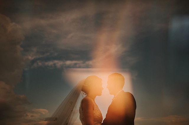 Triple exposure! How it&rsquo;s done: 
1. base shot of couple, almost silhouetted against sky (expose for sky), making sure to isolate them in the sky by shooting from down low to crop out background trees 
2. Picture of candle burning + a prism, sli