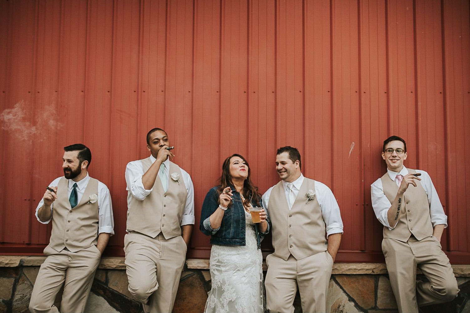 bride-with-groomsmen-smoking-cigars--1.jpg