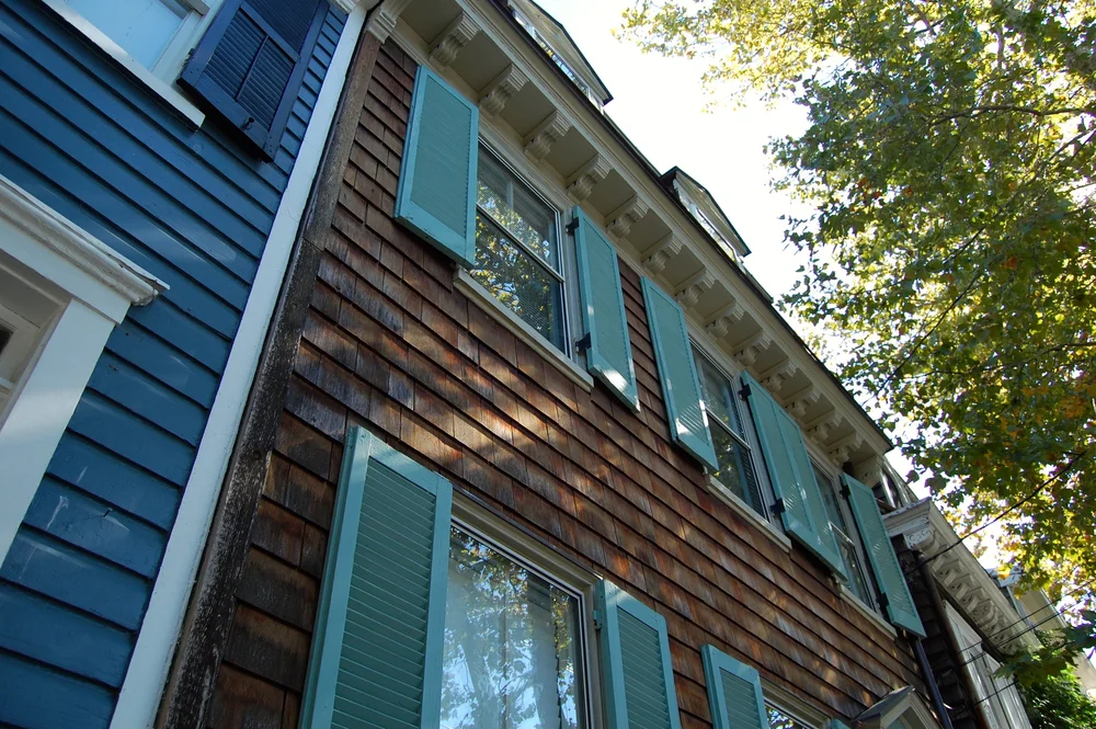 Colonial facade with wood shingles