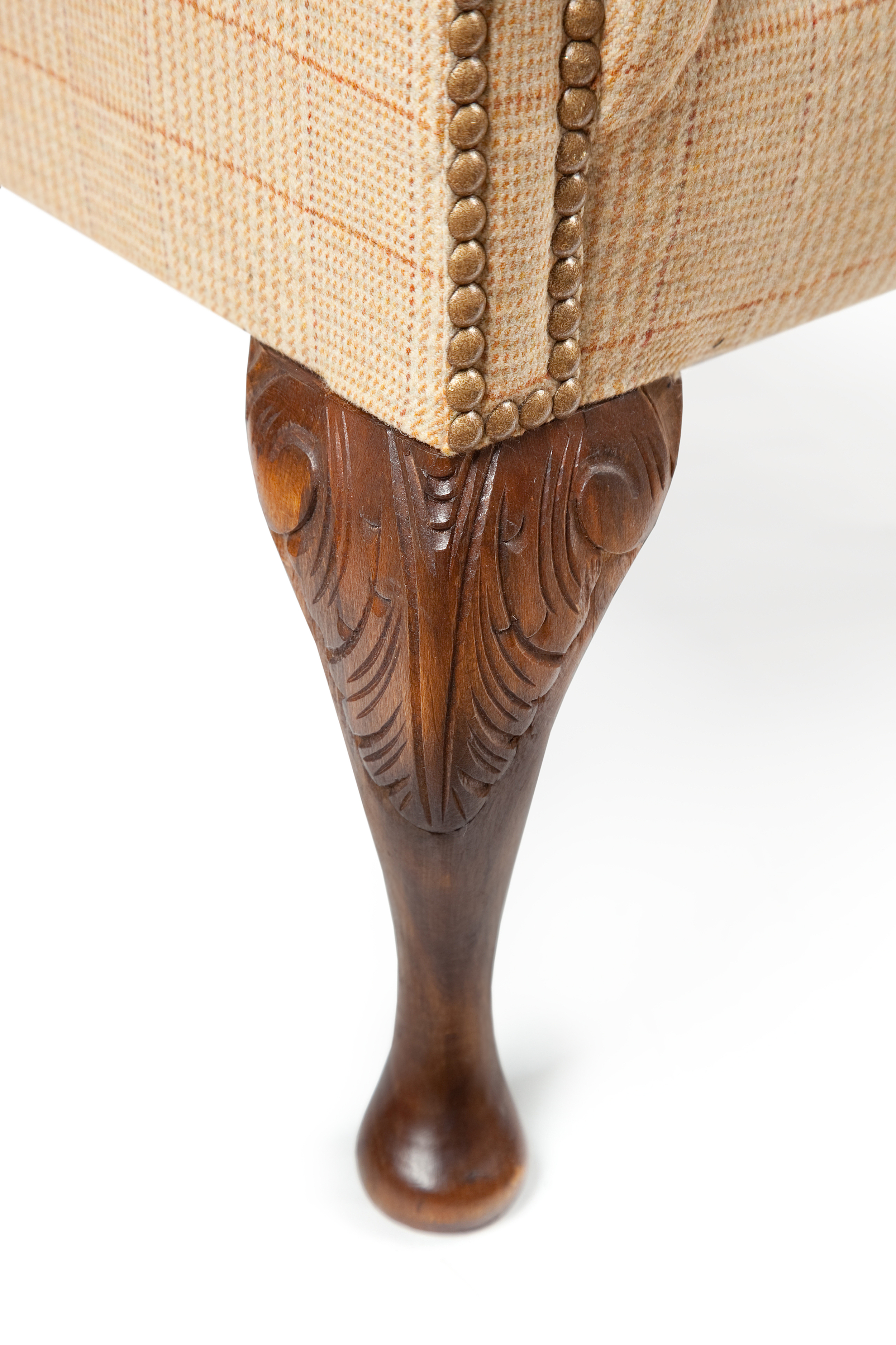 Choose from claw and ball, acanthus leaf and other beautiful handcarving options for wing chair legs