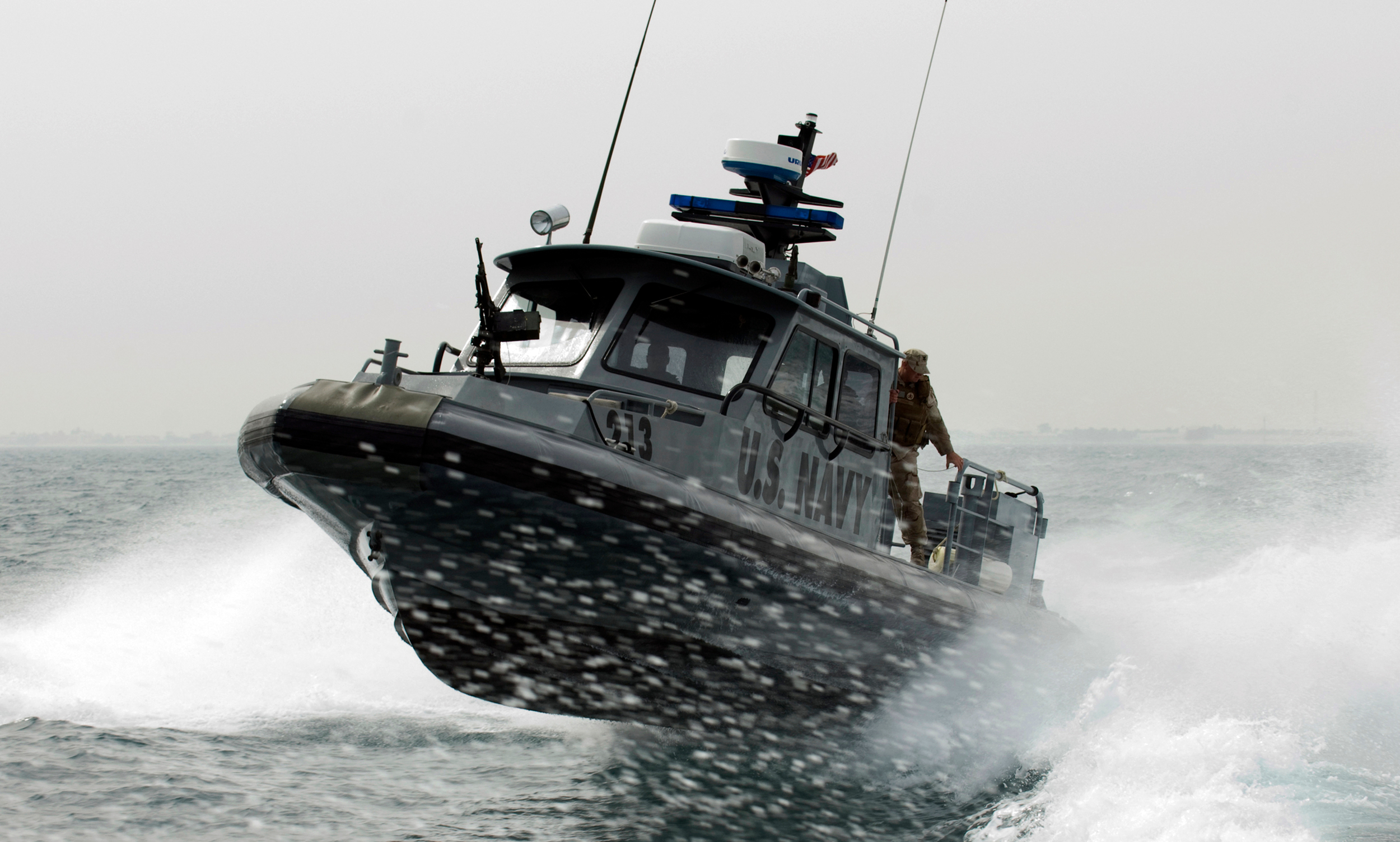 US_Navy_090210-N-9671T-144_A_port_security_boat_patrols_the_waters_near_Kuwait_Naval_Base.jpg