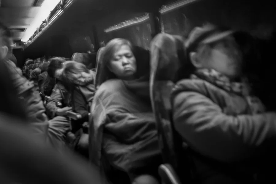 Asian immigrants sleeps on a bus headed to the Sands casino in Bethlehem, PA, Mar. 13, 2013.