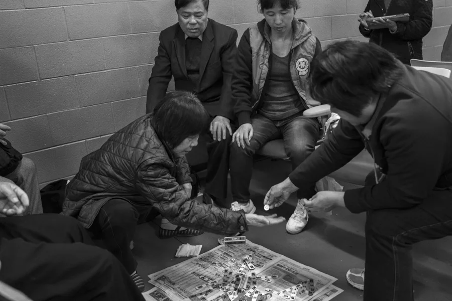 Playing traditional Chinese games inside the waiting room at the casino, Oct. 21, 2013.