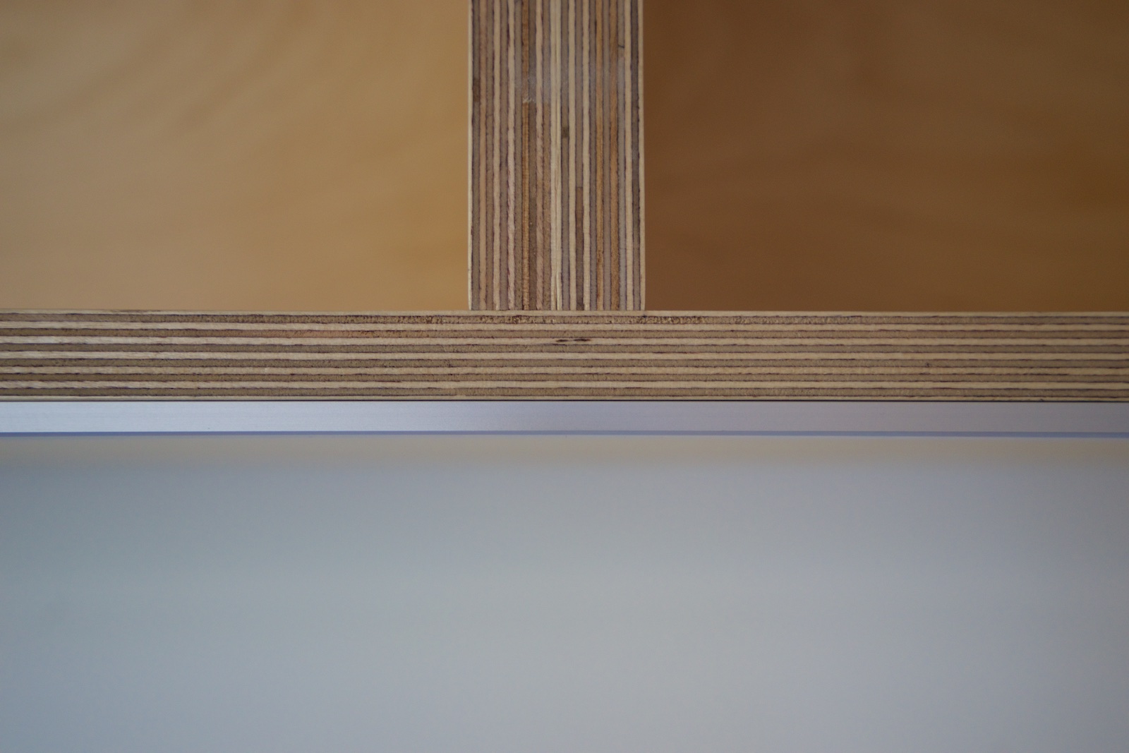 The very thin profile of the LED strip light inside an aluminum enclosure
