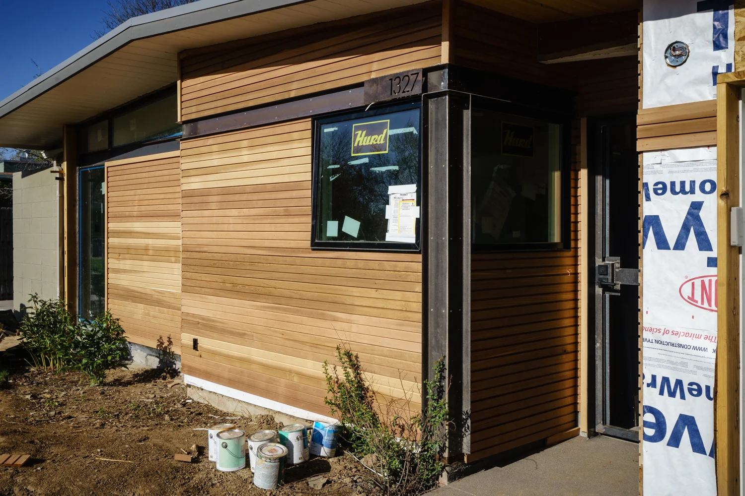 Cedar siding with steel detailing at entry