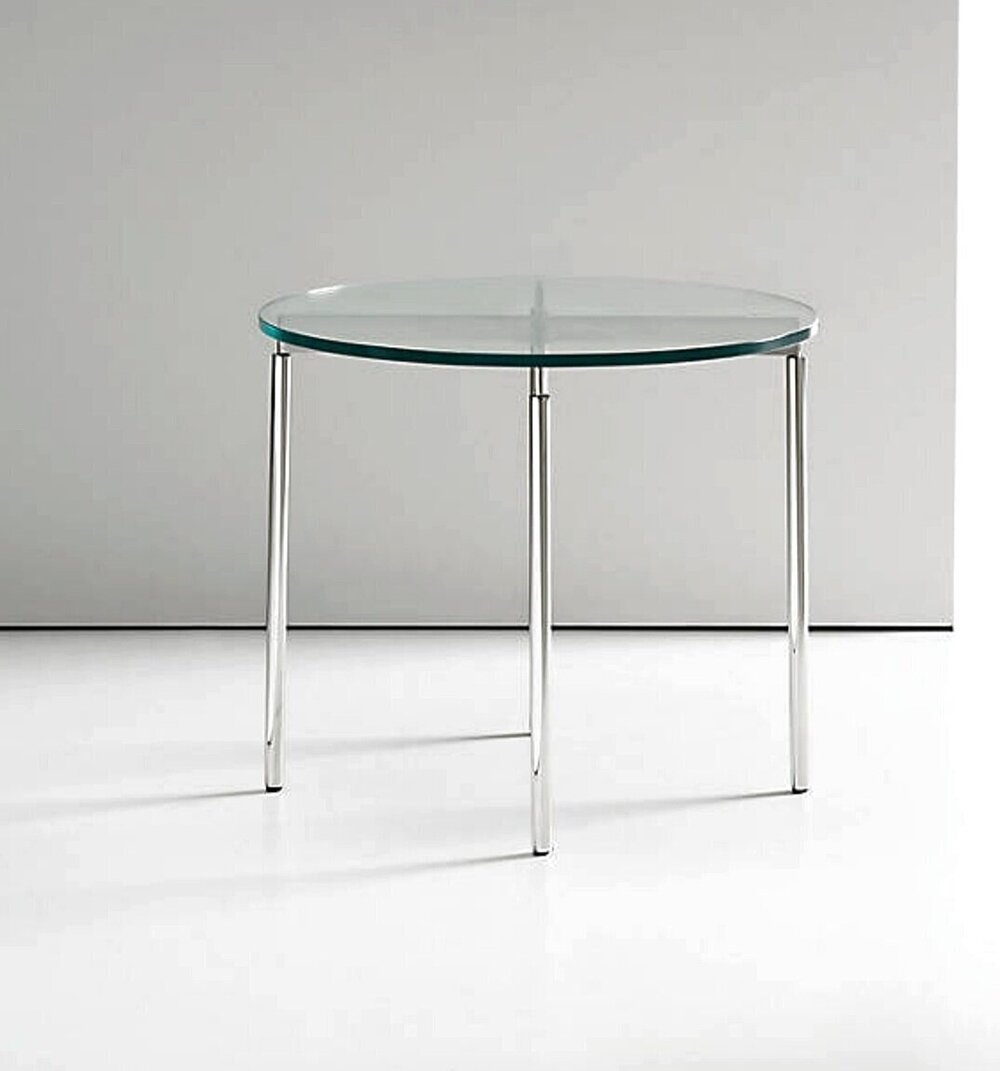   ^  Check out this simple classic glass and stainless steel table. The cp.3 occasional table 18”H x 21”DIAM. is available via  yliving  for $722.     