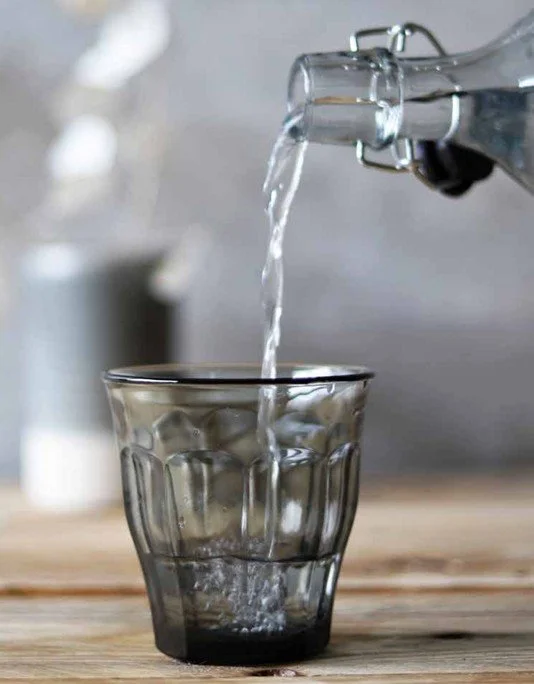 Water poured into a Duralex tumbler