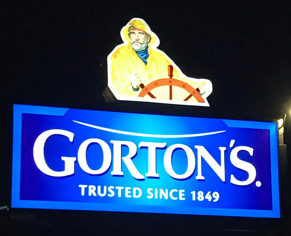  Illuminated vinyl install of Gorton’s fisherman logo, viewed at night  