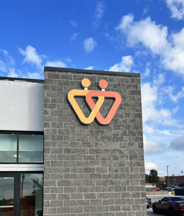  Orange and yellow vinyl logo during the daytime 