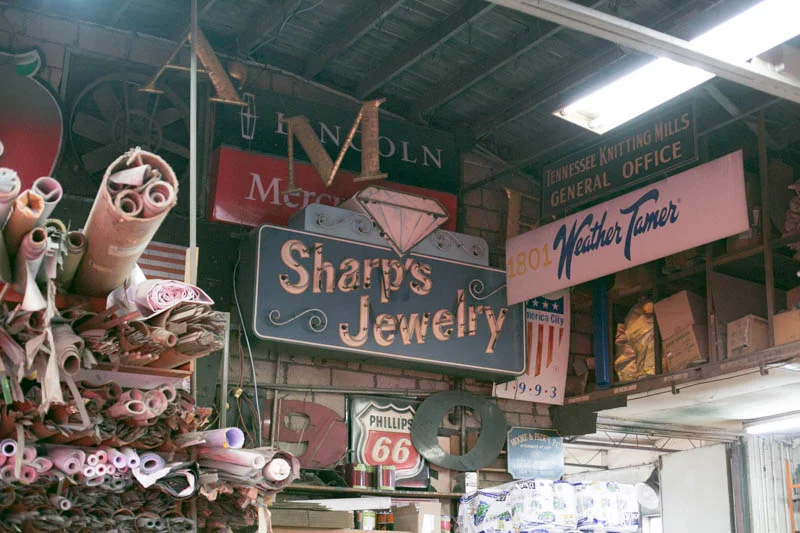 A collection of old signs from around Maury County are housed in the ceiling of their shop on Nashville Highway.