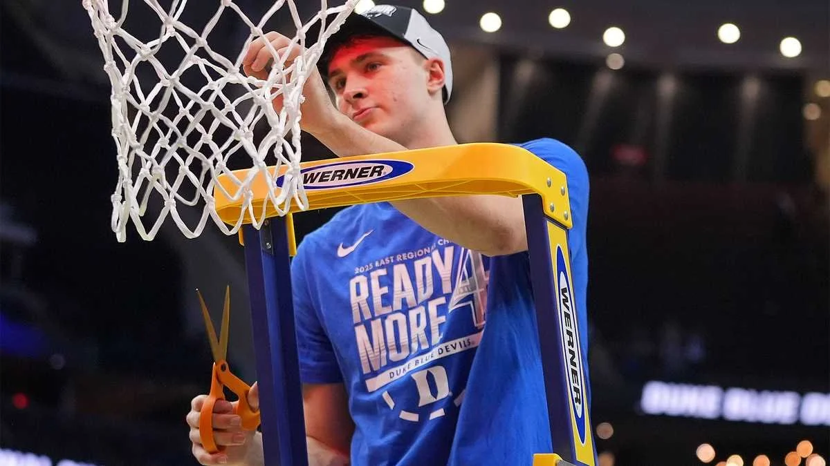 cooper-flagg-cutting-down-nets-after-elite-eight-67e9625d2cee5.jpg