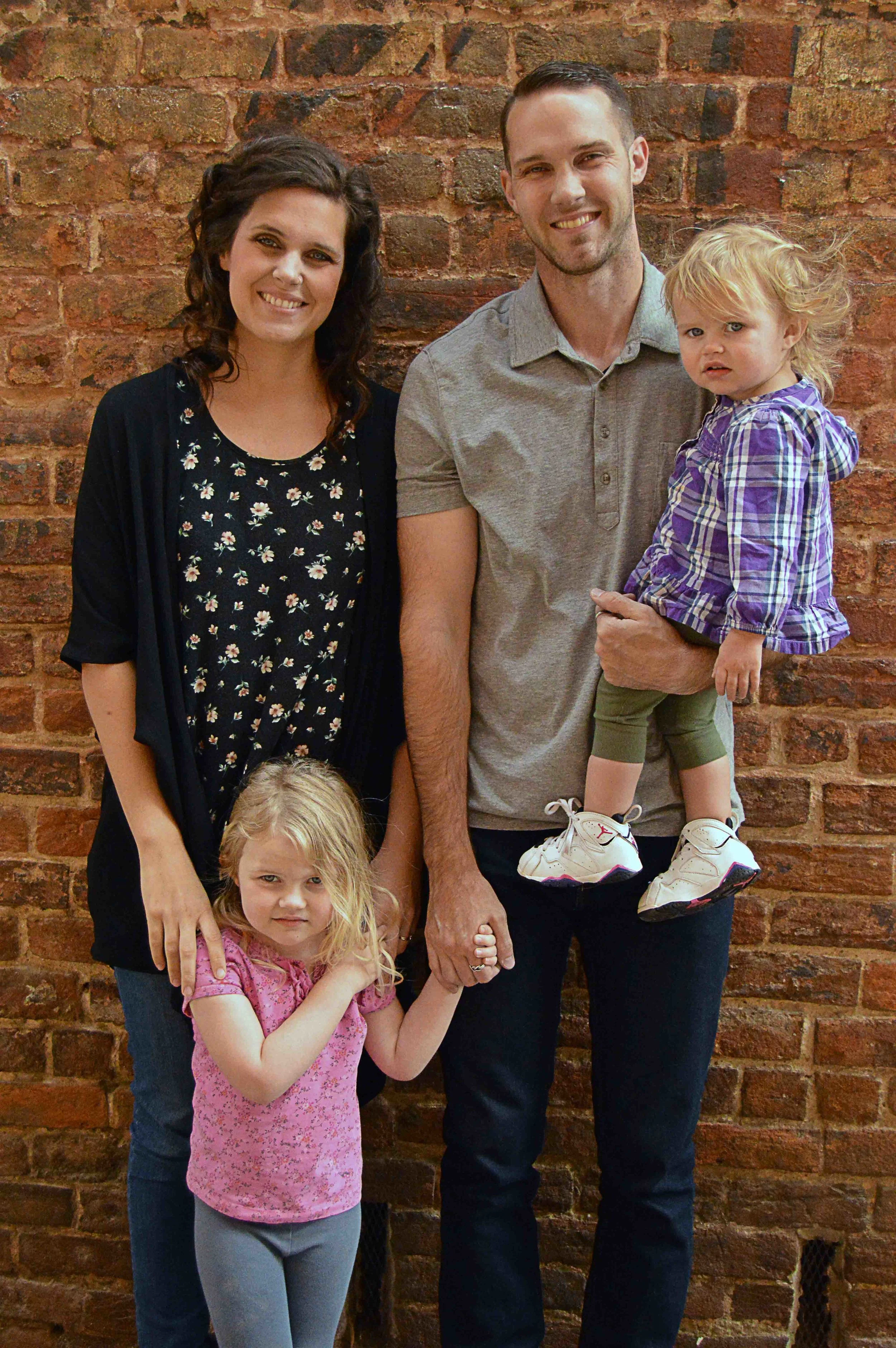 this is the "hey-our-kids-wouldn't-smile-but-you-can-still-know-what-we-all-kinda-look-normal" photo. They're sweet girls. We promise :)