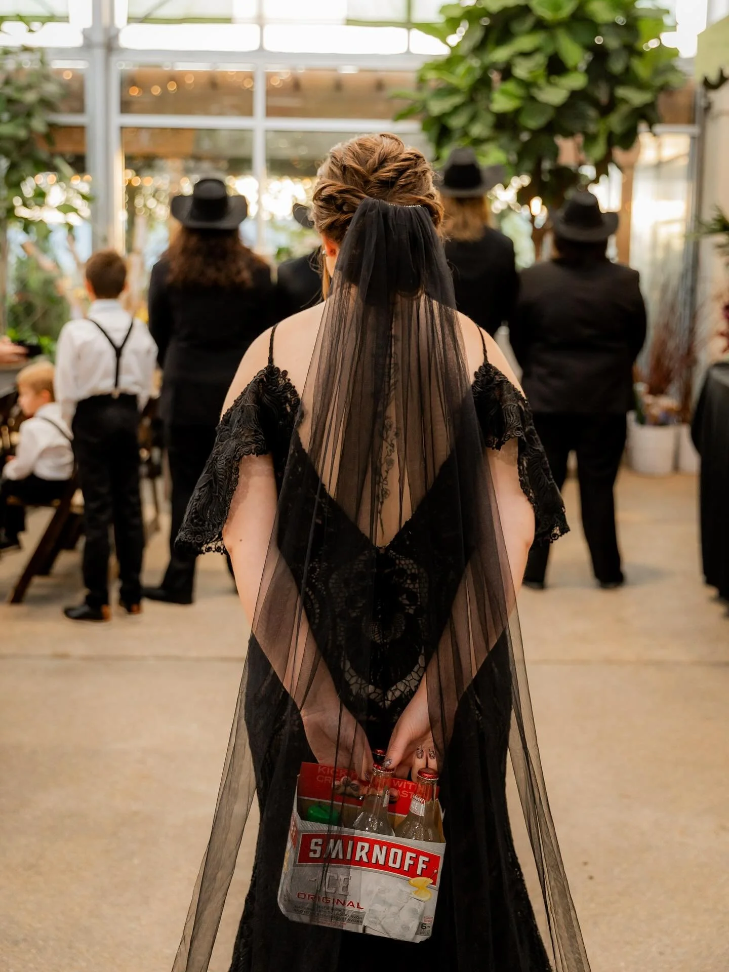 A first look with a little twist!! And yes, a bride in black because it&rsquo;s October 🖤🎃 swipe to enjoy the prettiest Halloween themed greenhouse wedding!