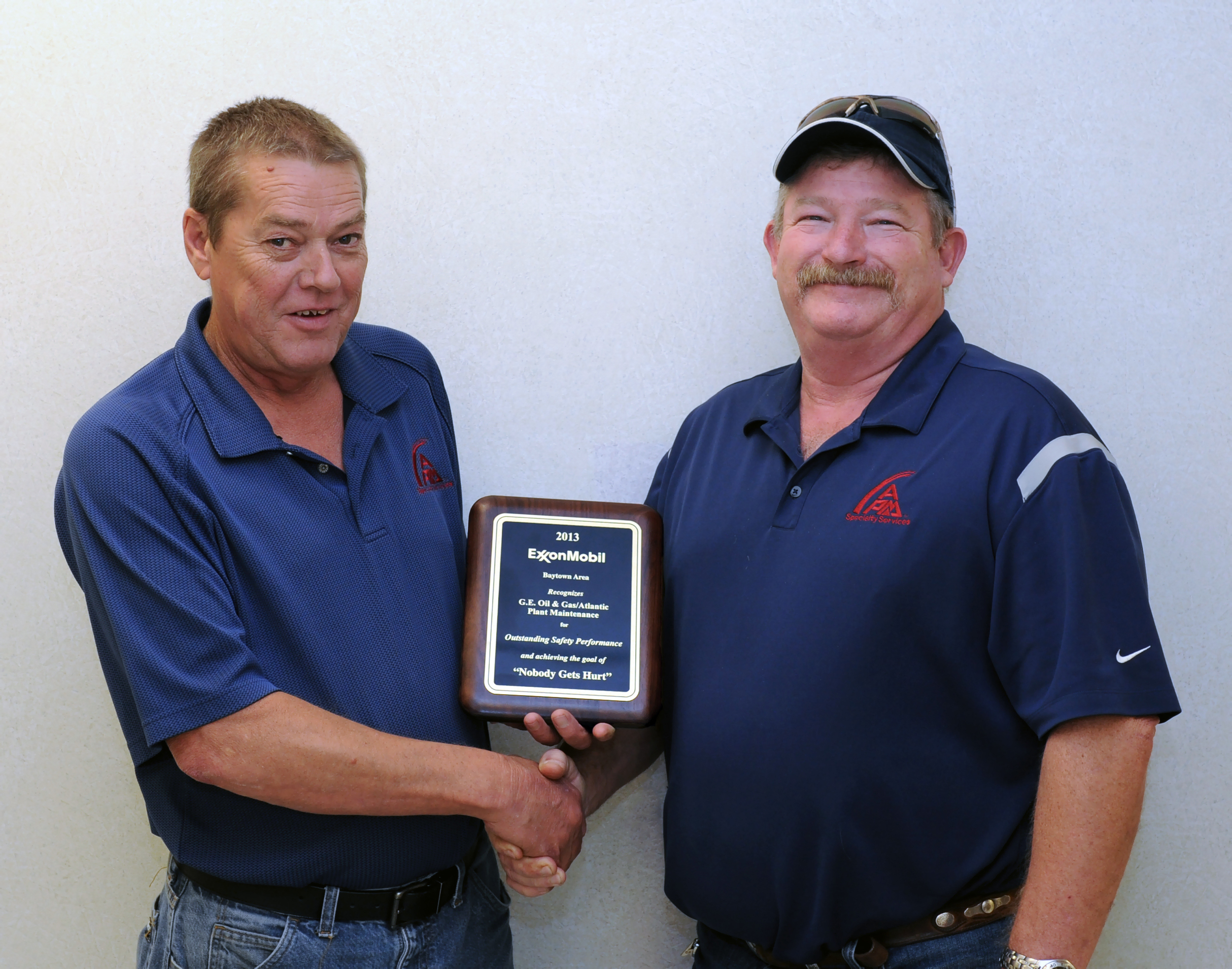 Pictured above, left to right: Ronnie Campbell, APM Specialty Services Projects Manager, Exxon Mobil Baytown, TX Garry Syphrett, APM Specialty Services Operations Director