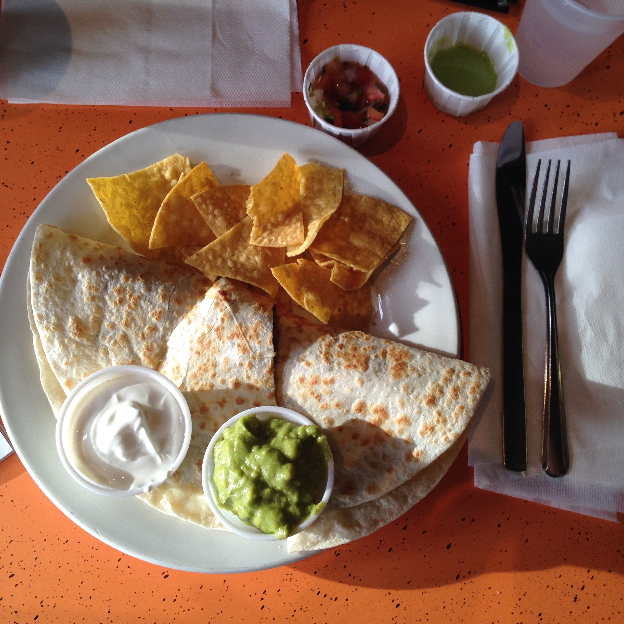 steak quesadilla with a side of sour cream and guac - perfection.