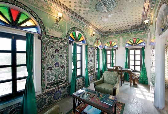 A beautifully restored lounge in Fort Begu displaying frescoes and mirror work