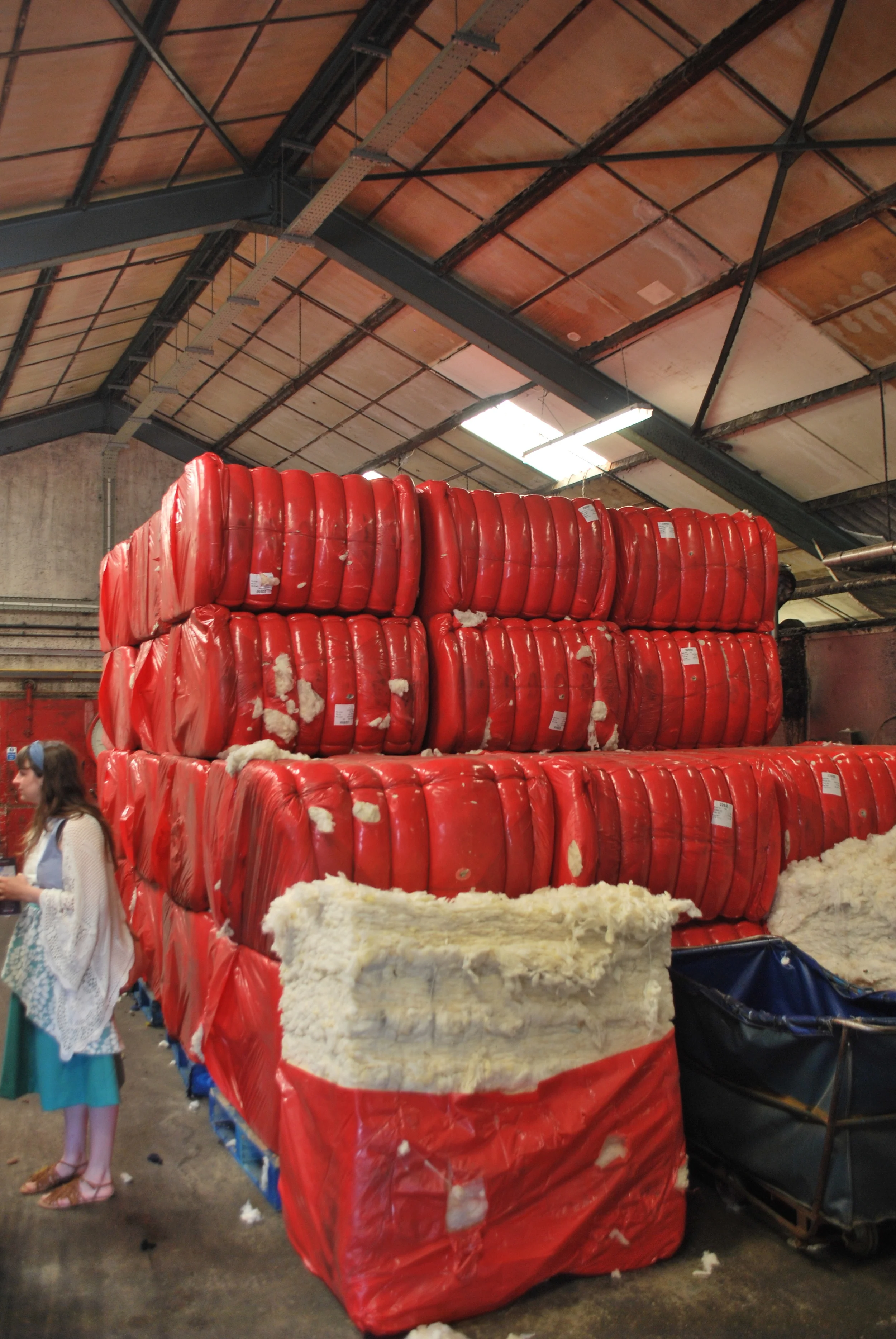 The raw wool is brought in by the masses. Unfortunately there are not enough sheep on the Island to produce all the wool, although you'd be happy to know it is 100% Pure Virgin British Wool.
