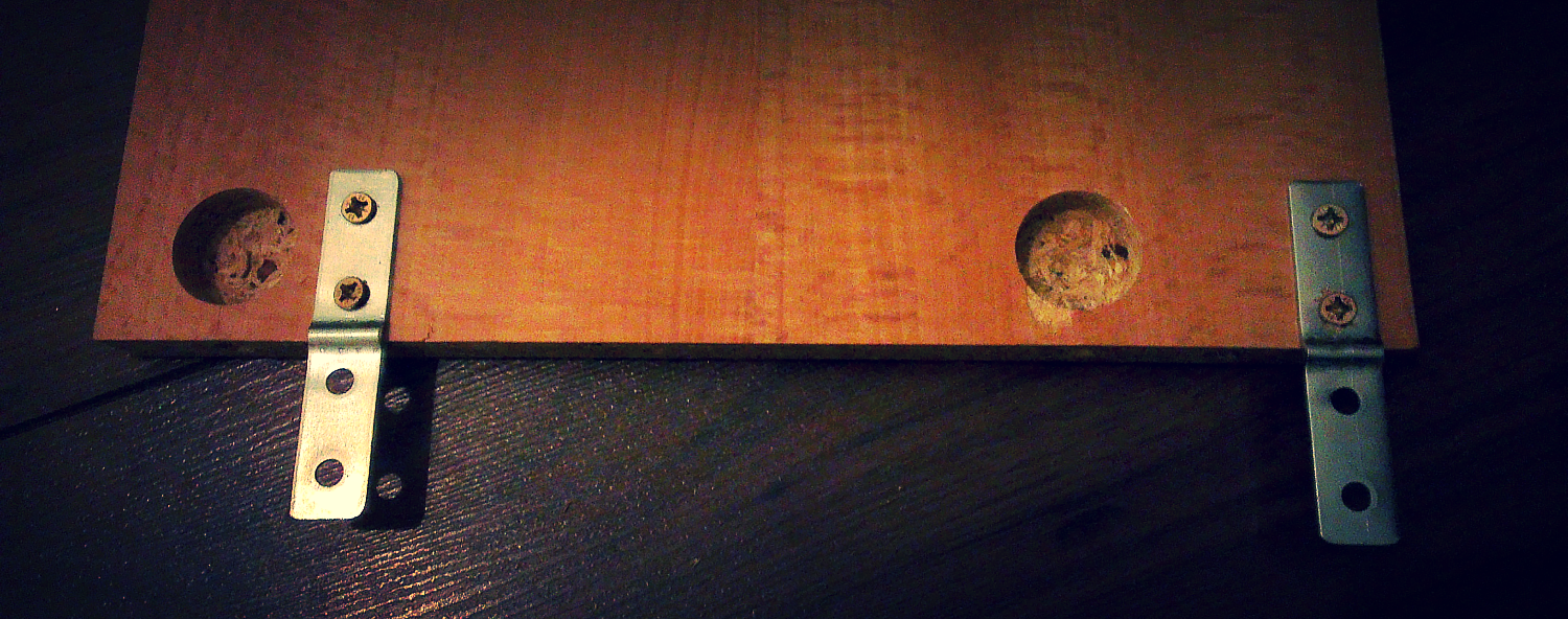 Two flat brackets go on the end of each shelf, allowing them to be attached to the underside of each ladder rung. 