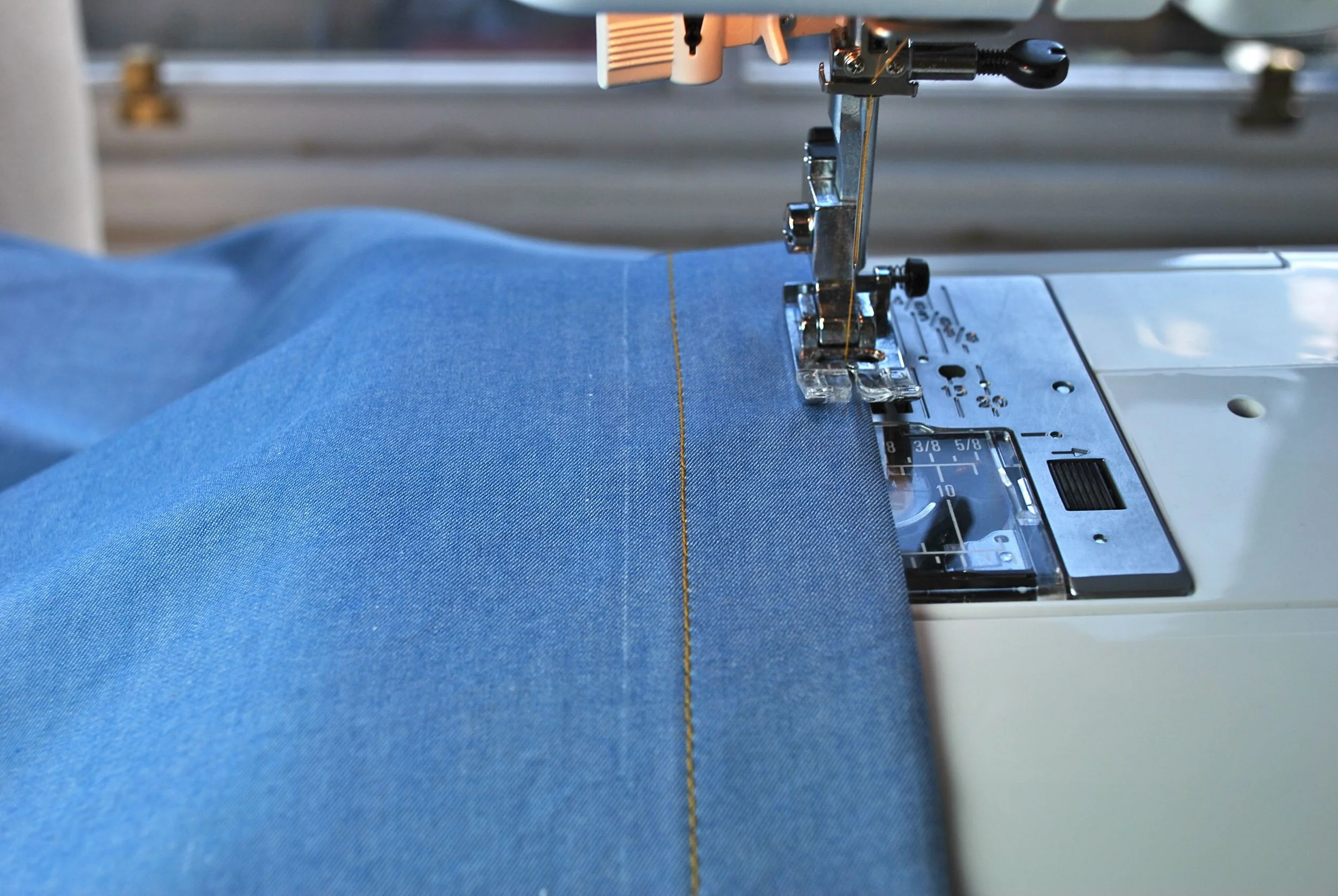 The left-hand button placket being edgestitched. 