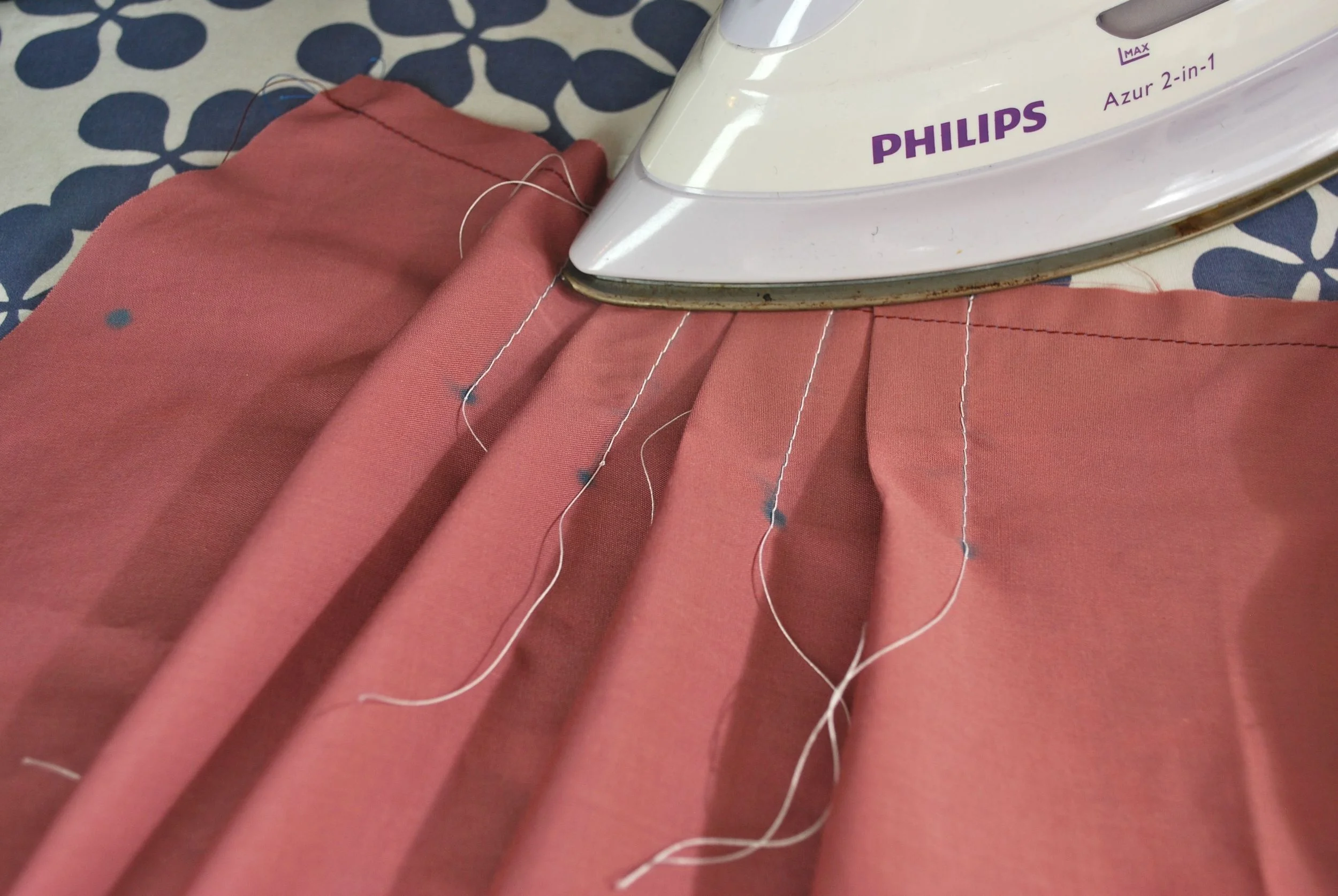 Pressing the pleats .