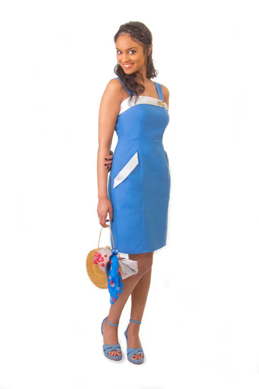 LILY Colette Princess seam sundress with a curve skimming fit. The neckline and pockets are adorned with a flap detail that can be made in self fabric (version 1) or contrasting fabric (version 2). The skirt is slightly tapered for a slim fit, and includes a back kickpleat for ease of movement. The back closes with an invisible zipper. 