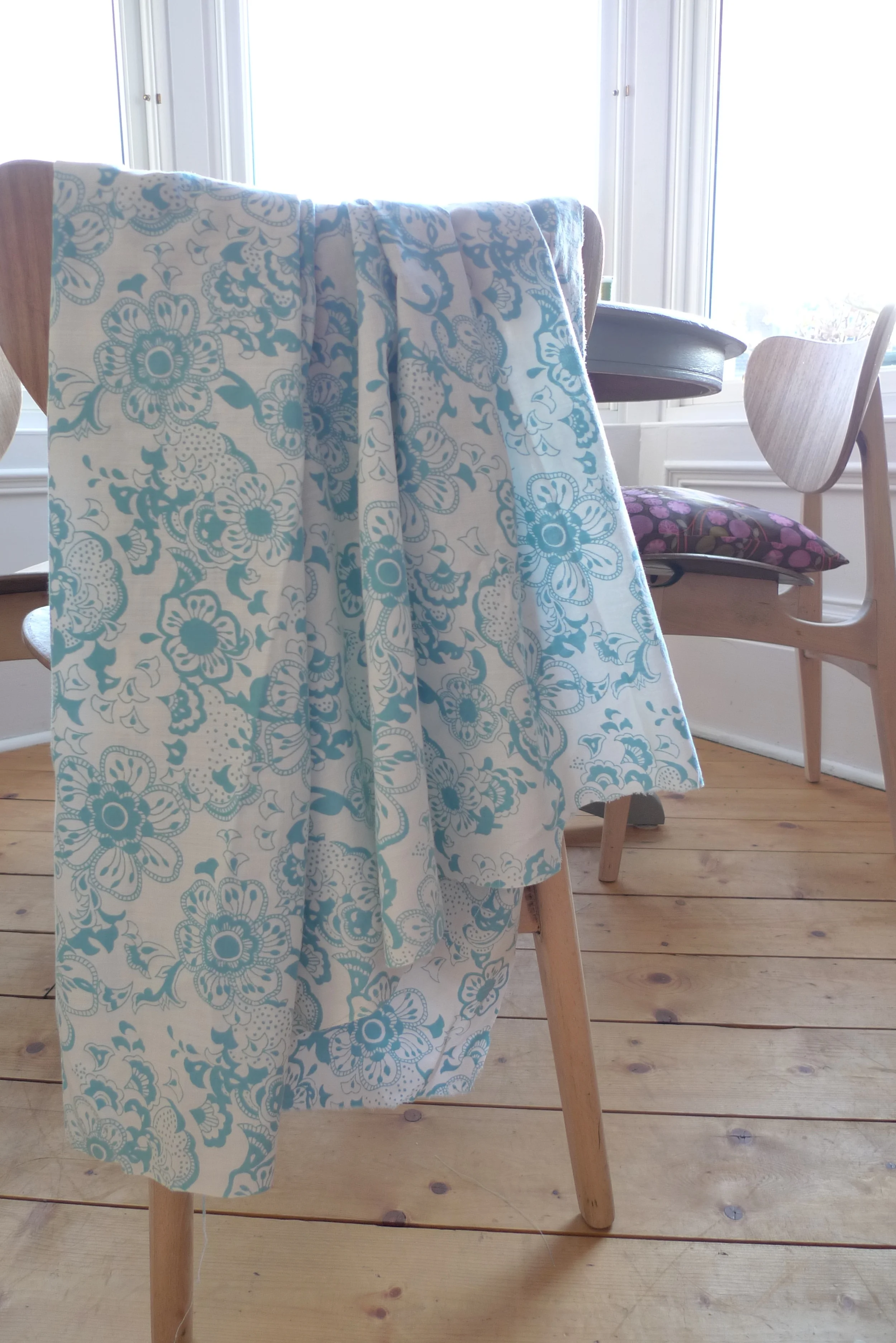 This is a lightweight soft cotton, it drapes well, but it's too flimsy for a cushion.