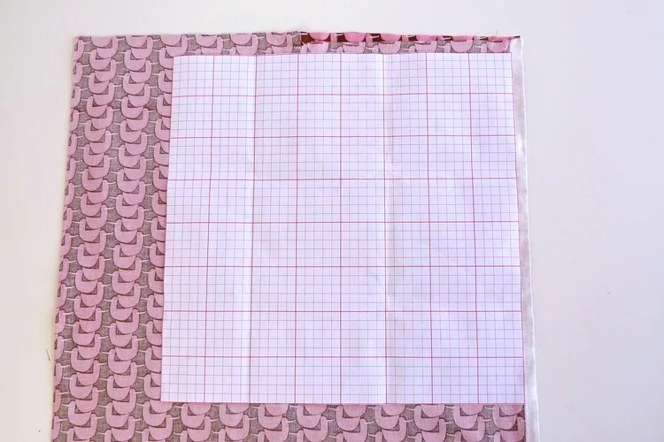 I've positioned my squared paper, aligning it with the inside of the selvedge. 