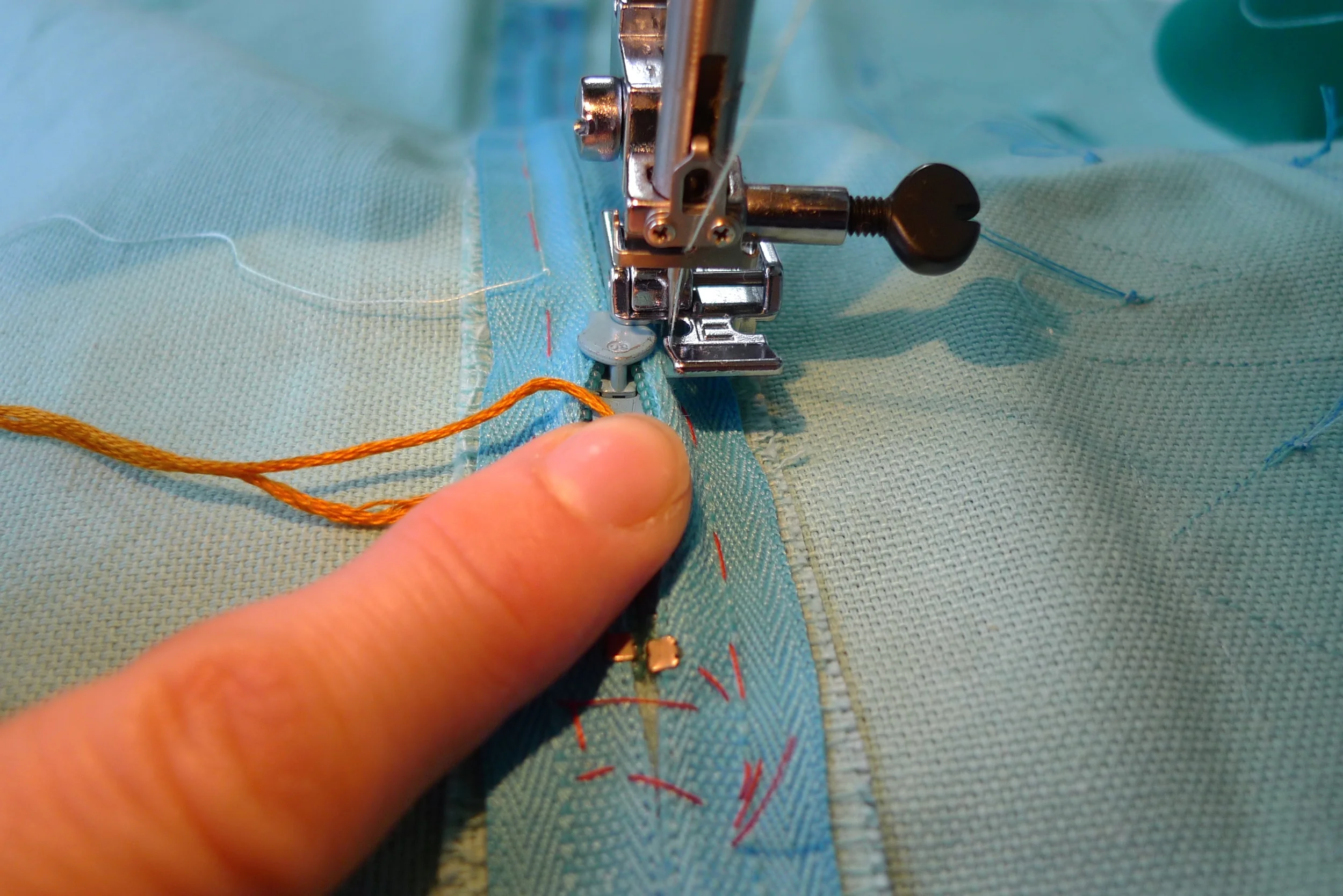 STEP 4f - Gently pull the zip past the needle and 