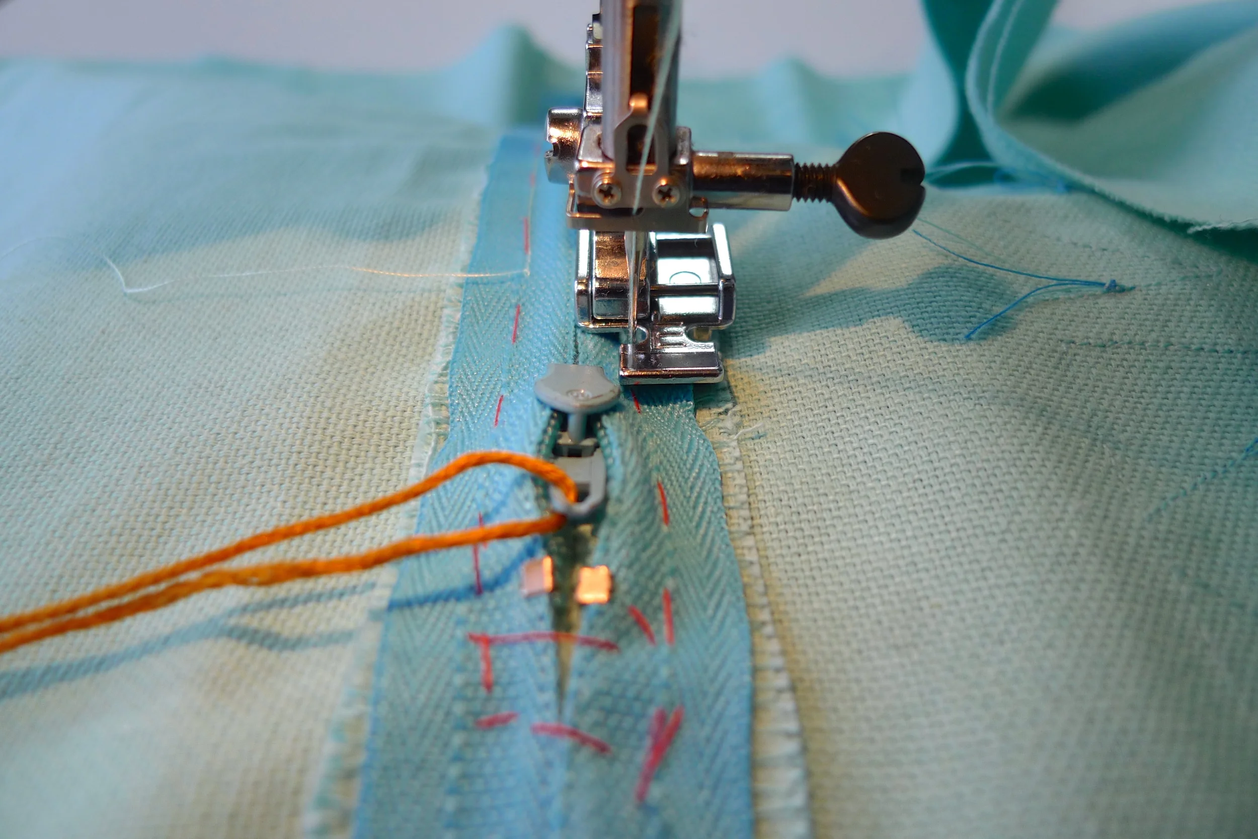 STEP 4e - Stop just before the toe of the presser foot reaches the zip pull. 