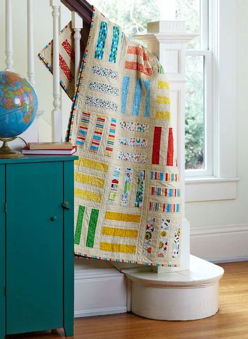A traditional Rail Fence quilt, created by April Lahoda. 