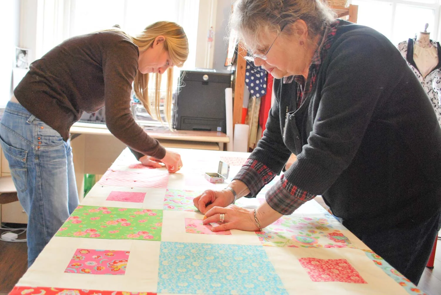 Layering up during one of our quilting courses. 