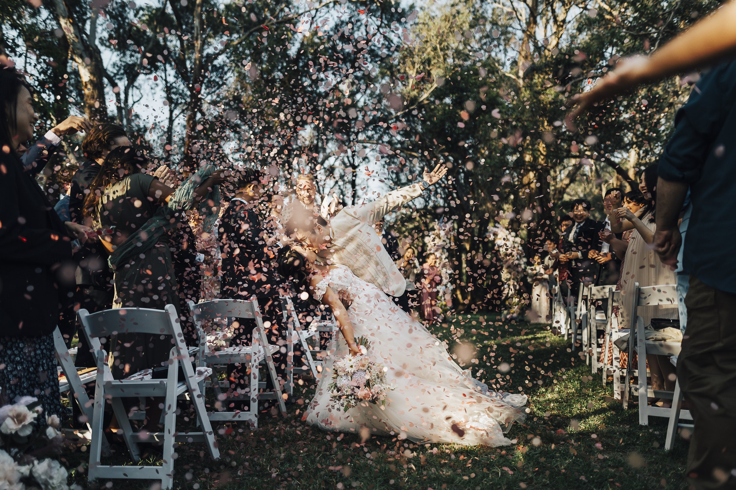 Louise and Dan post-ceremony kiss at Oscar’s in the Valley. Candid wedding photography in the Swan Valley hills. Pure joy.