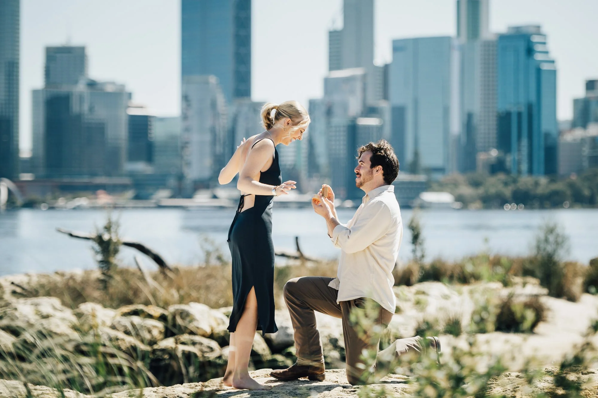 Perth CBD proposal photographer captures the ecstatic reaction of a partner jumping with joy after a surprise proposal.