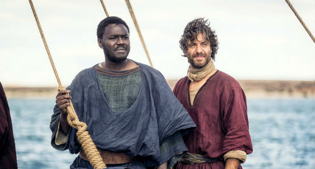 John (Babou Ceesay) and Peter (Matthew Levy) look to a strange figure on the shore... (Hint: it's Jesus.) 