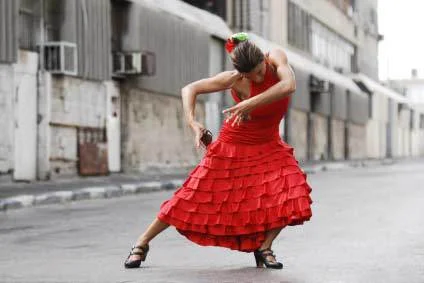 Female flamenco dancer in dancing pose in Spain