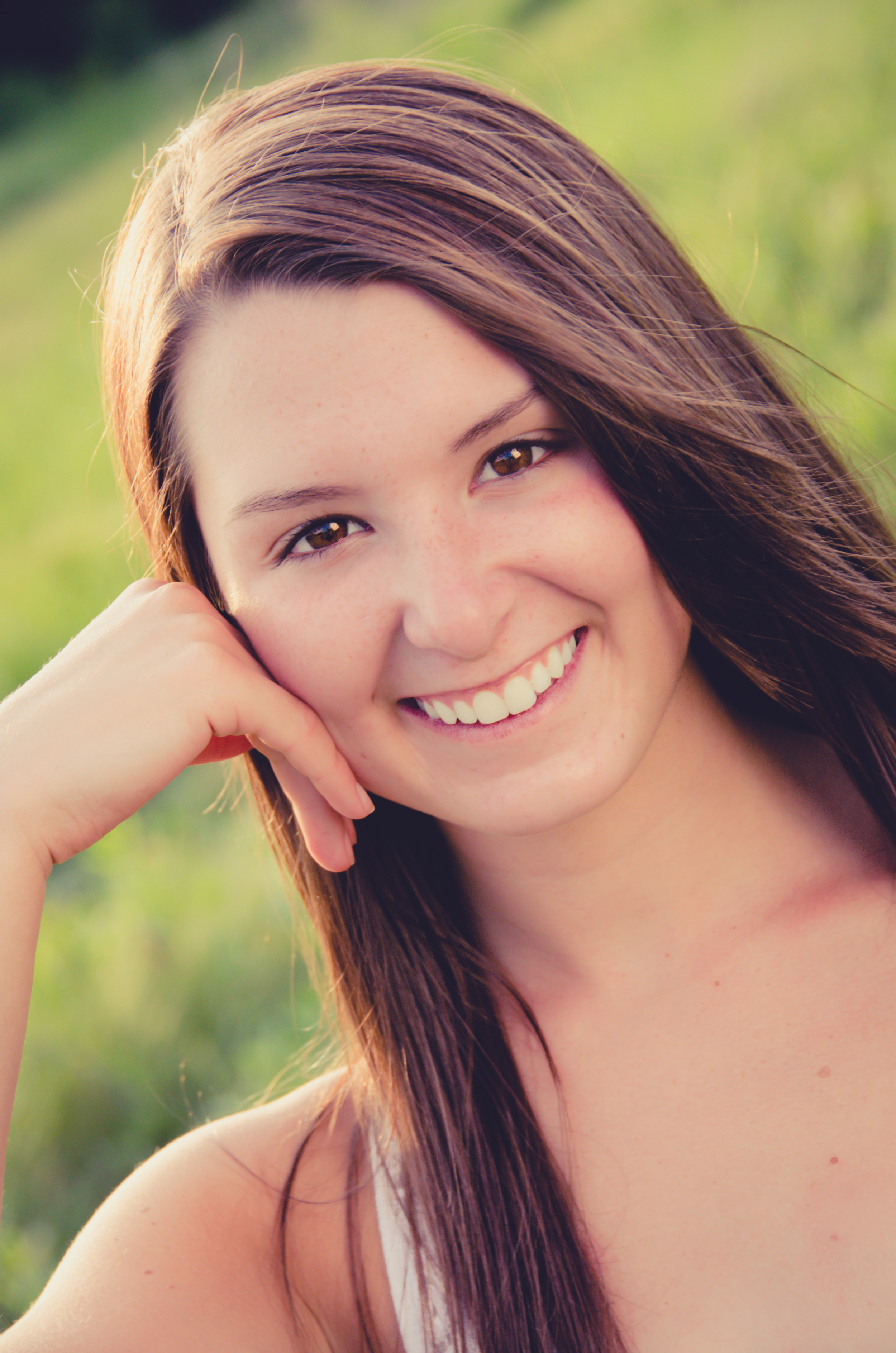 Notice the lighting in this picture.&nbsp; The model is placed so that the sun is behind her creating highlights on her hair and in the background.&nbsp; A reflector was used in front of the subject to reflect light off of the sun to brighten the ey…