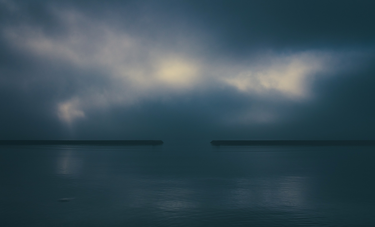Riding my bike along Lake Ontario every day - you can't help but notice the play of light between the sky and reflections on the lake. How different the same scene can appear from day to day is incredible.