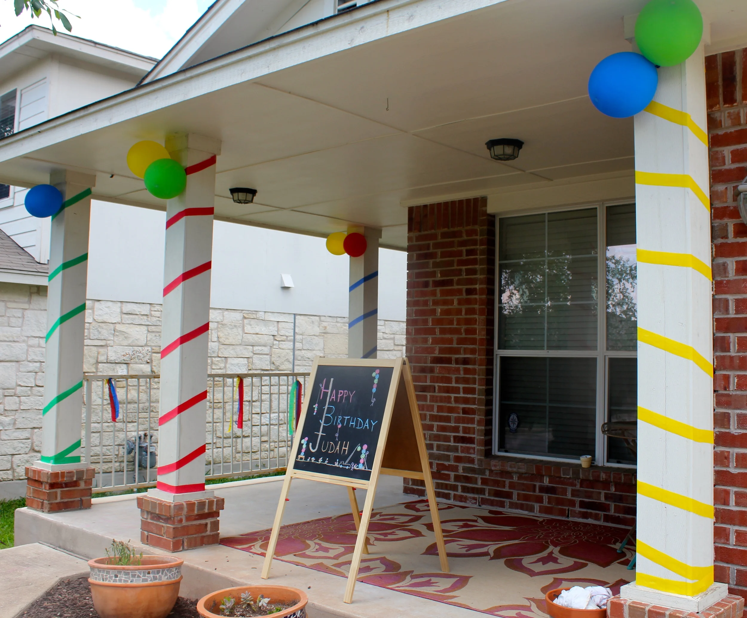 Chalkboard sign - artistic talents of my dad; festive pillars - daring feat of my mom!