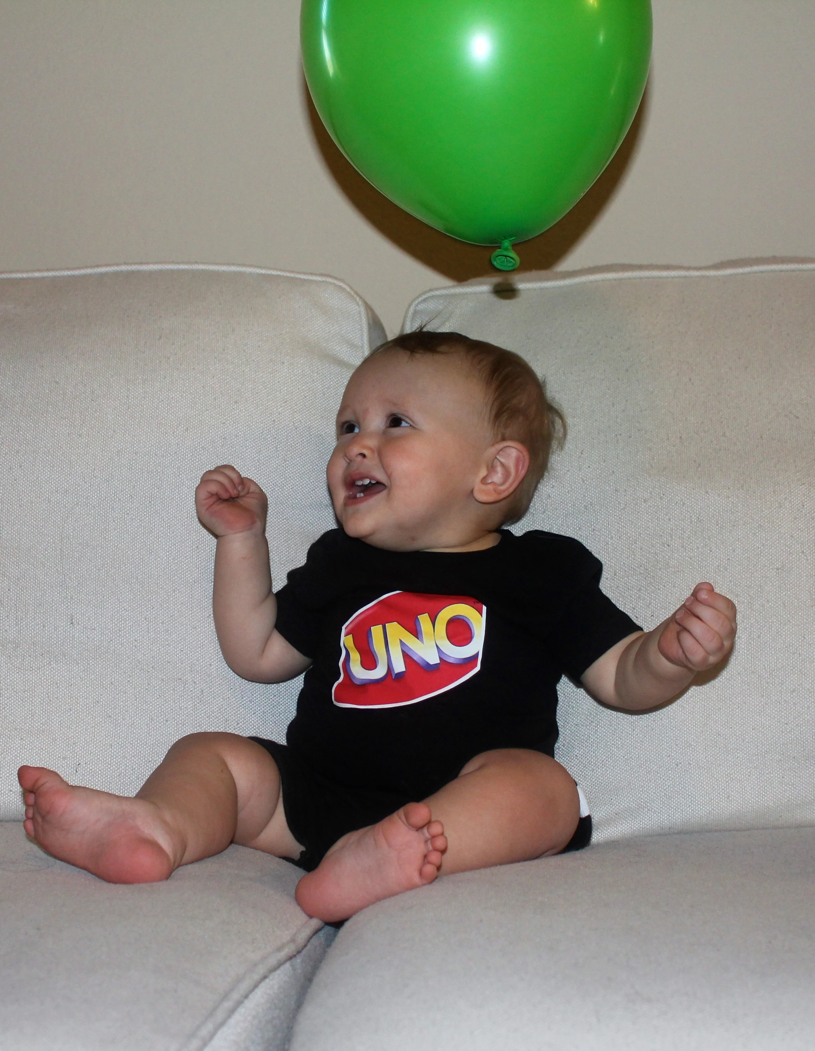 Oh I get it - UNO cause he's one!