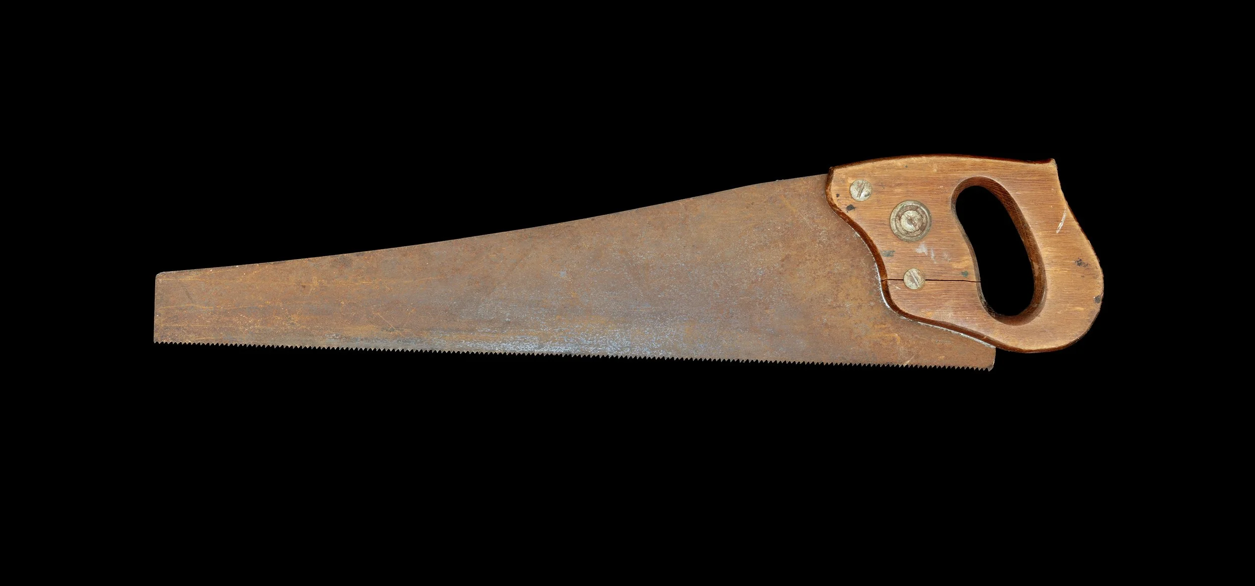 Image of a rusty hand saw against a black background