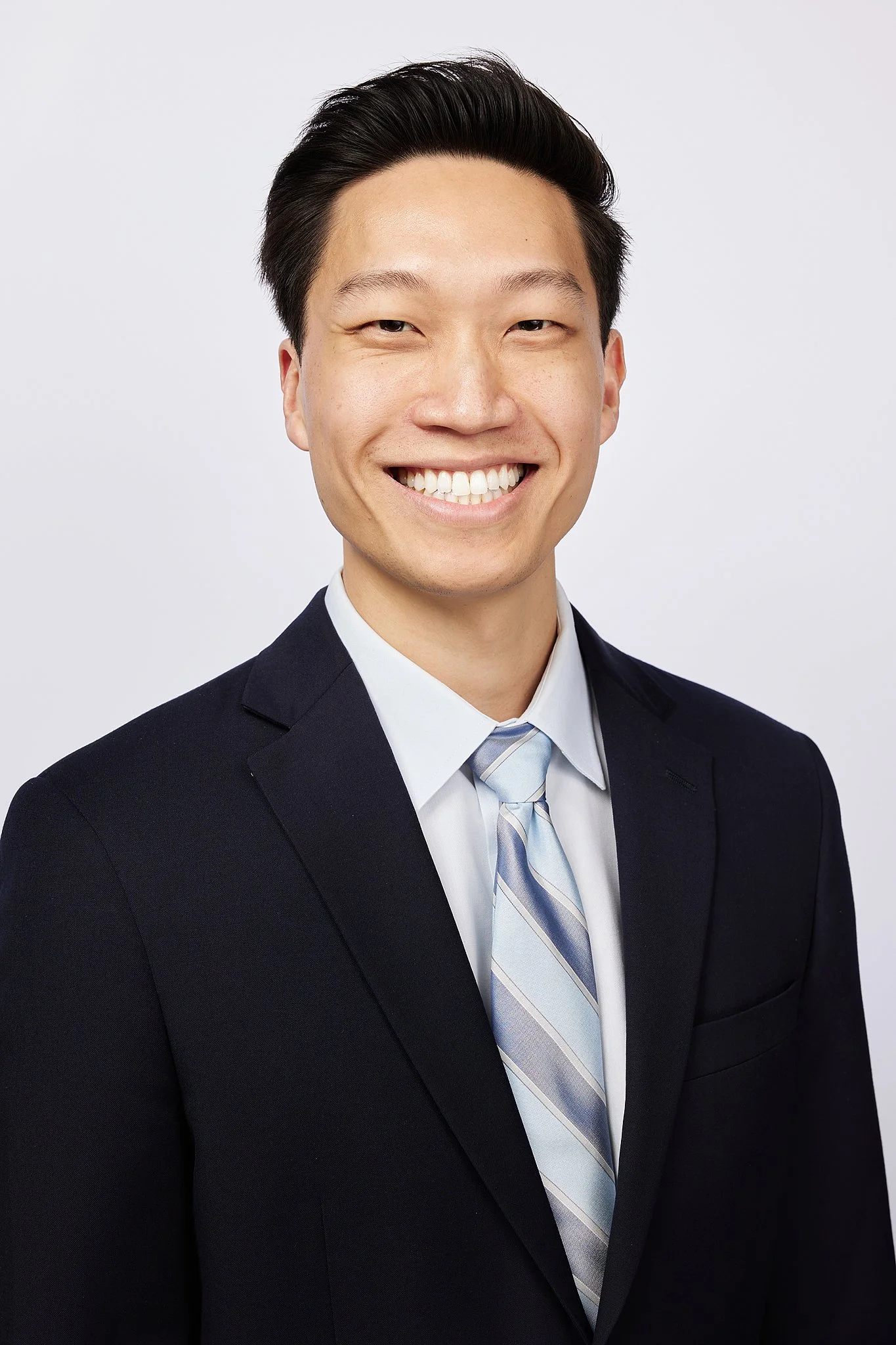 corporate-headshot-austin-tx-man-dark-suit-striped-tie.jpg