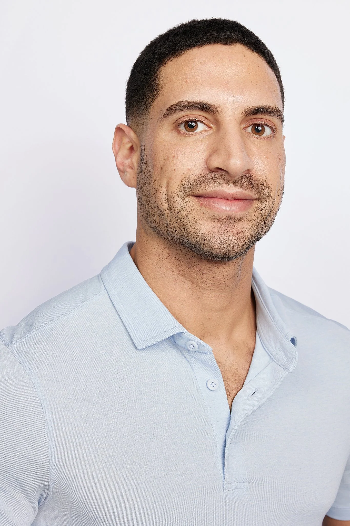casual-business-headshot-austin-tx-man-light-blue-polo.jpg