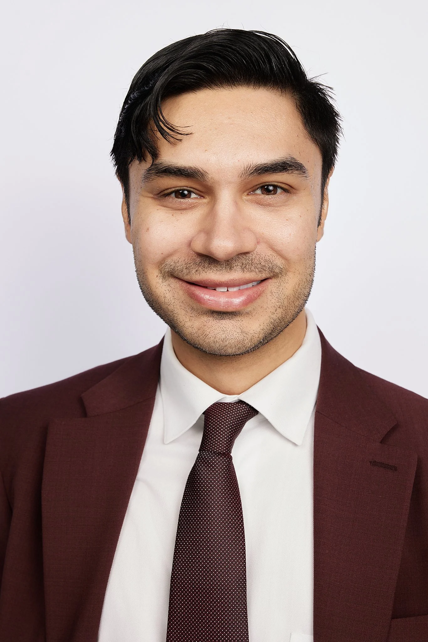 professional-headshot-austin-texas-man-burgundy-suit.jpg