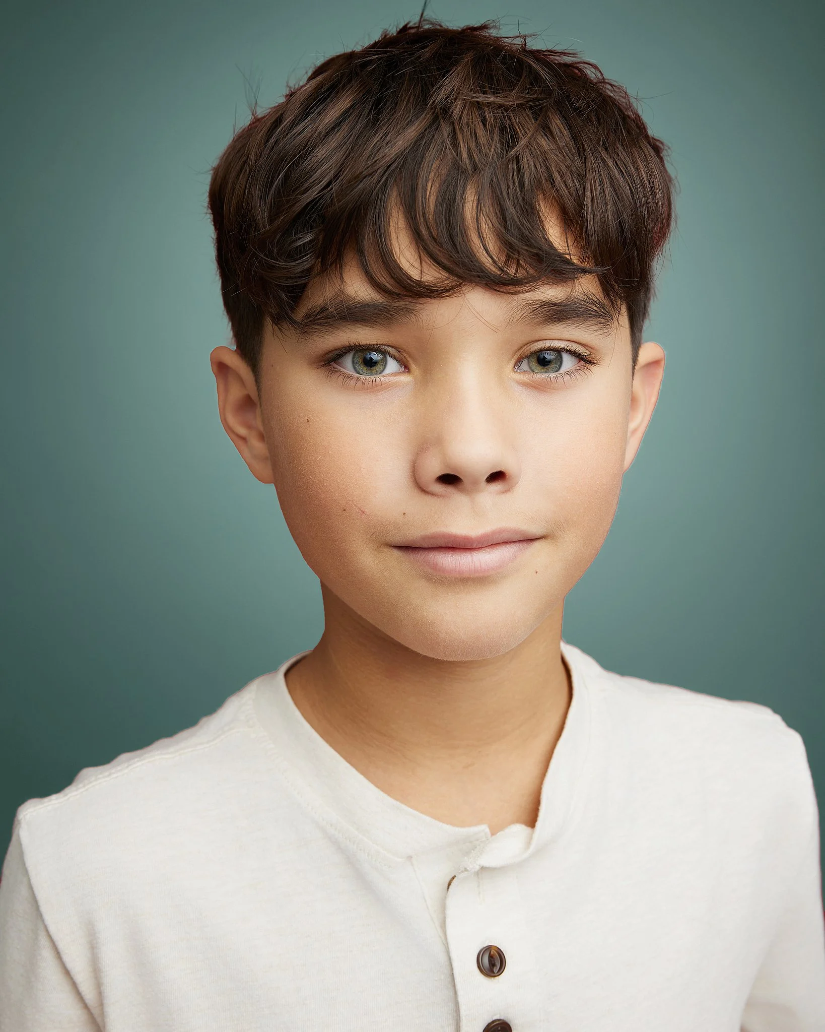 kids-headshot-austin-texas-boy-teal-backdrop.jpg