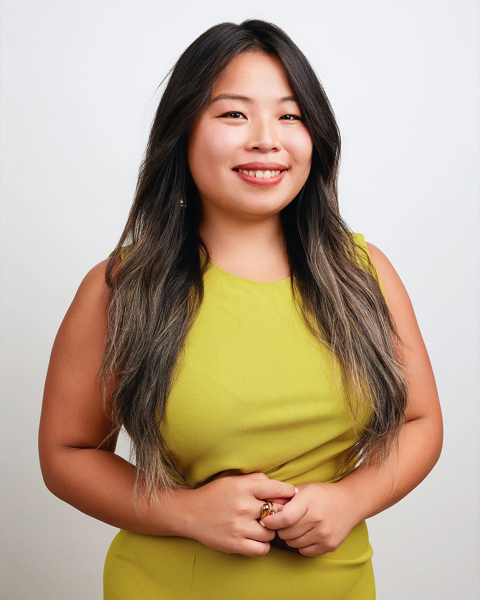 austin-headshot-photographer-woman-yellow-dress-white-backdrop.jpg