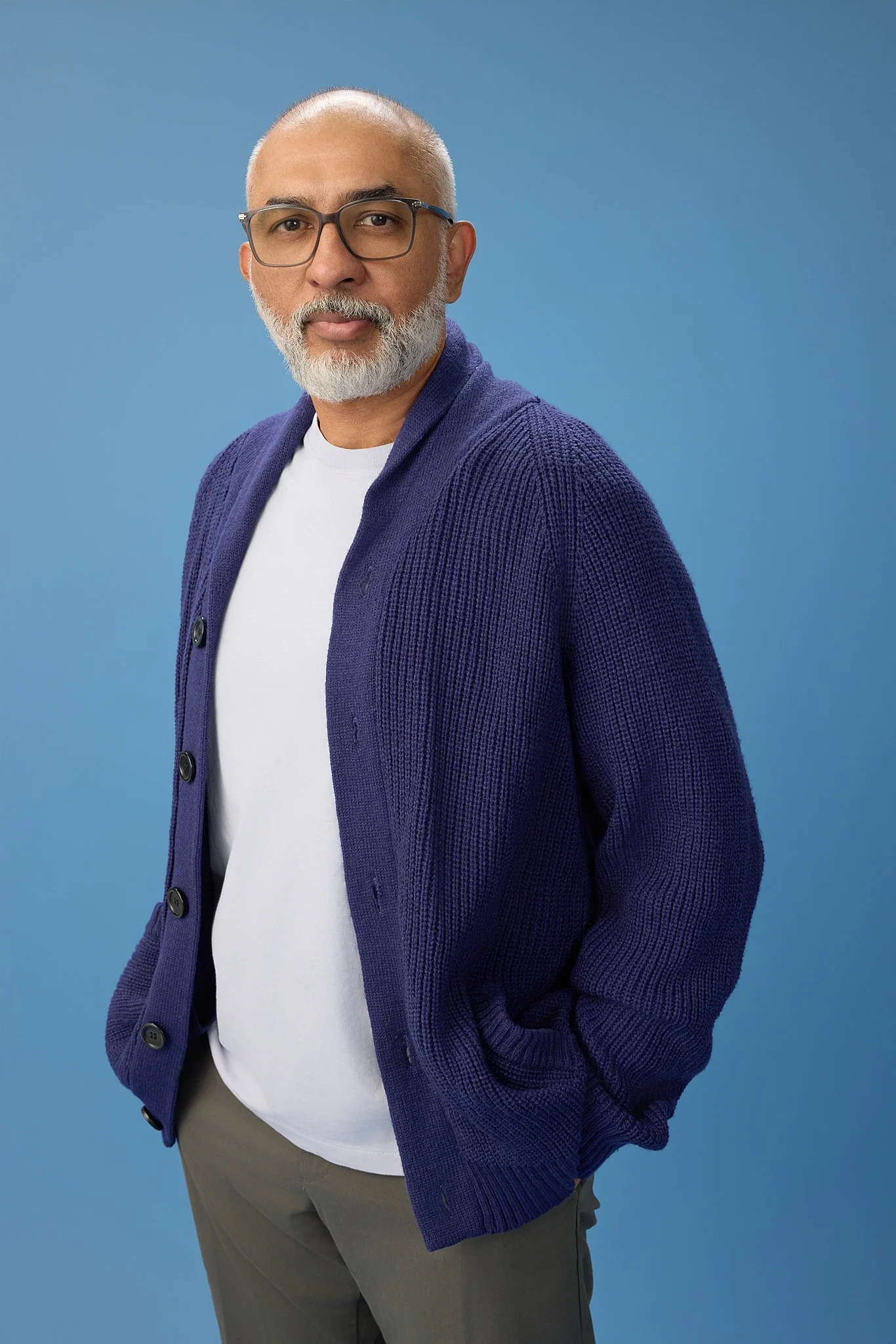 business-portrait-austin-tx-man-blue-cardigan-blue-backdrop.jpg