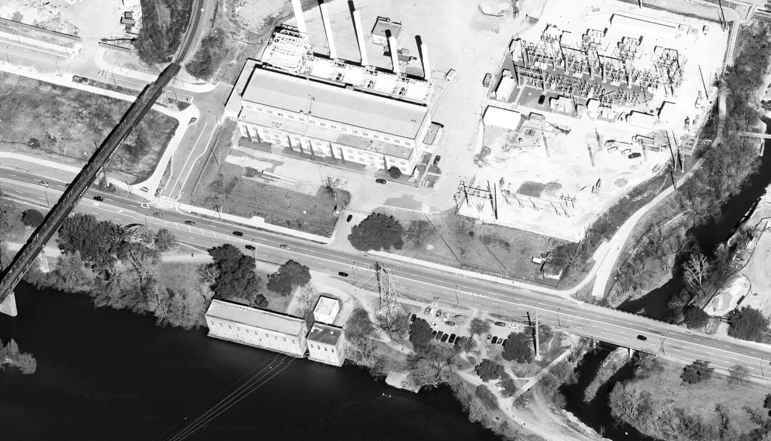 Existing Site -- Seaholm Power Plant and Intake Buildings along Lady Bird Lake.